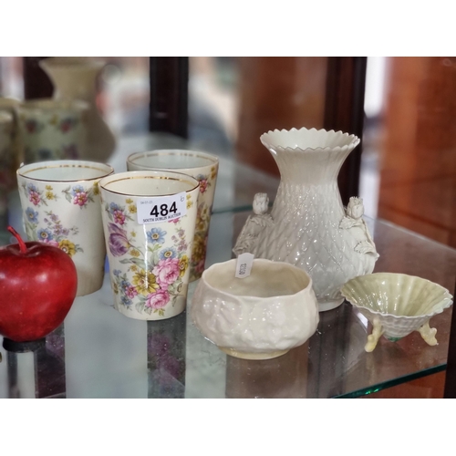 484 - A selection of six ceramic items comprising of three Belleek dishes including a vase and a shell sha... 