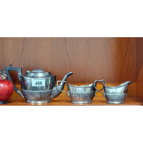 486 - Three matching tea service items comprising of a teapot, a milk jug and sugar bowl.