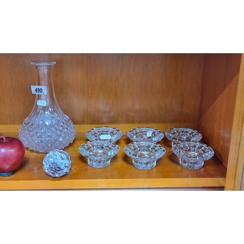 490 - Seven glass items comprising of a decanter with stopper and six cut glass candle holders. In very go... 