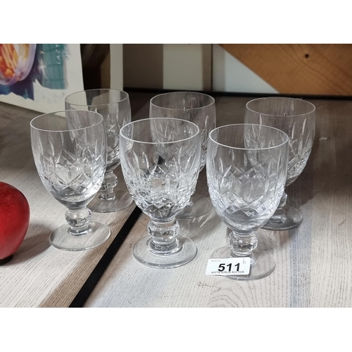 511 - A set of six matching heavy short stemmed wine glasses with deeply cut geometric pattern. All in ver... 