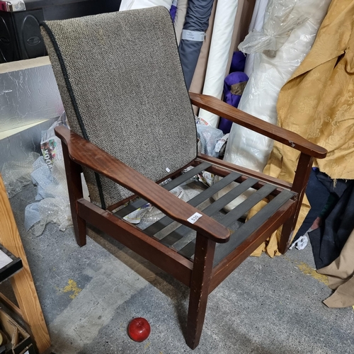 530 - A handsome mid century teak tall back arm chair with grey upholstery and curved wooden arm rests. (m... 