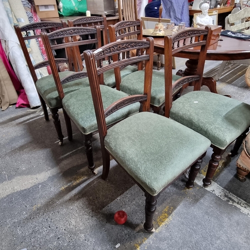 532 - A set of six Edwardian mahogany dining chairs with carved floral finials, turned legs set on ceramic... 