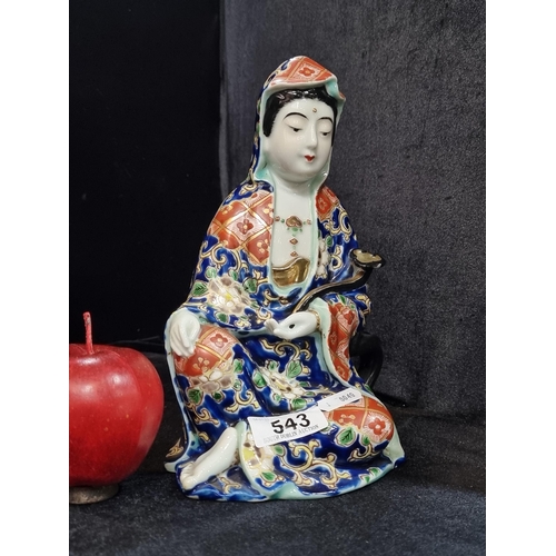 543 - A beautiful Japanese hand painted porcelain figure wearing traditional dress. Featuring gilded detai... 