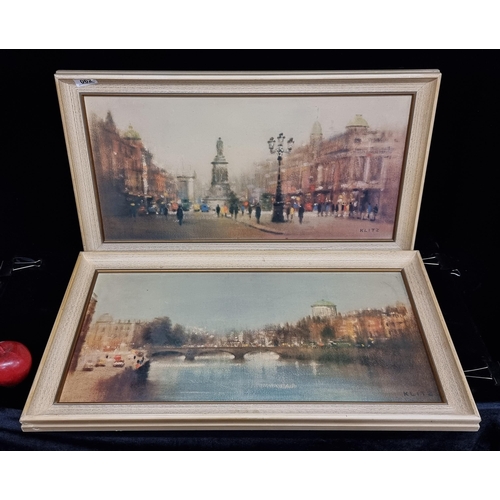 62 - Two framed prints of works by Klitz, featuring urban scenes of city life in an impressionistic style... 