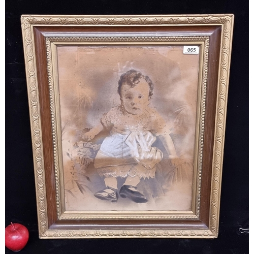 65 - A large daguerrotype antique photograph of a young child with delicate curls in period dress. This p... 