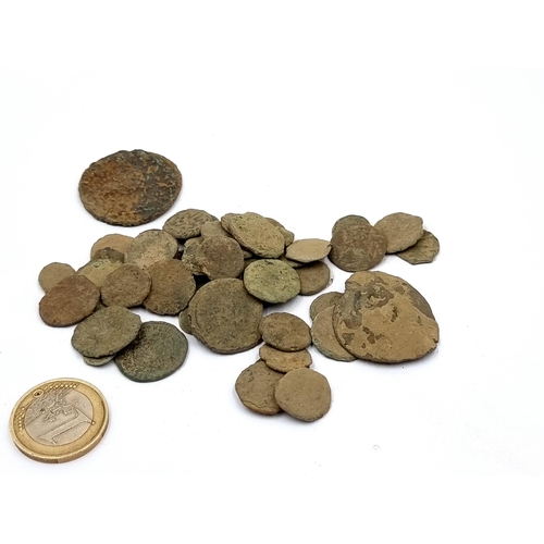 761 - A collection of uncleaned roman excavated coins. Approx 30. Total weight: 81. 80 grams