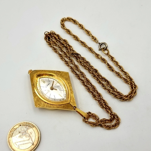 766 - A fabulous vintage top wind pendant watch and chain with gold tone finish. In working condition acco... 