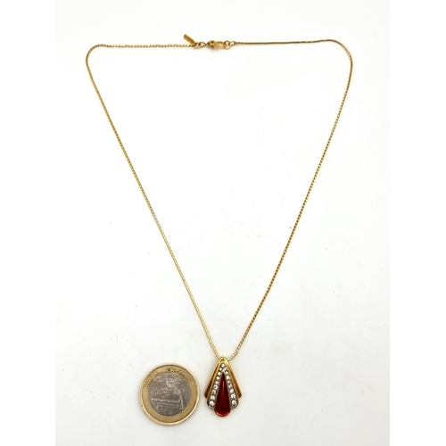 768 - A pretty gold toned Monet designer gem set pendant and chain.
Length: 42 cm