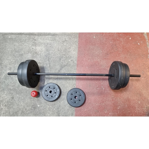 783 - An Olympic weight bar and six adjustable weight plates (equalling 30kg total).