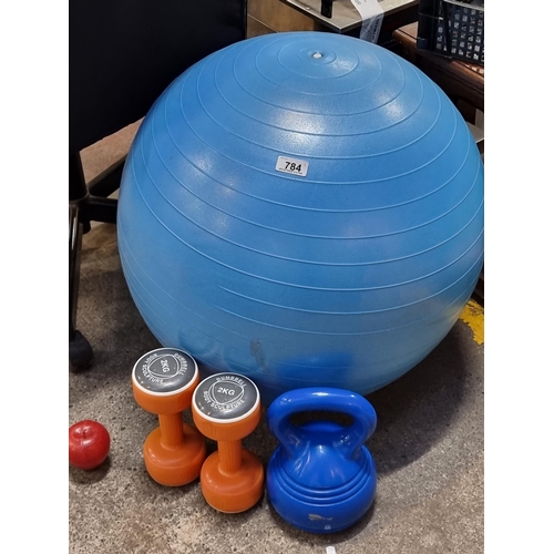 784 - A good collection of home gym equipment comprising of a Swedish exercise ball, a pair of 2kg dumbbel... 