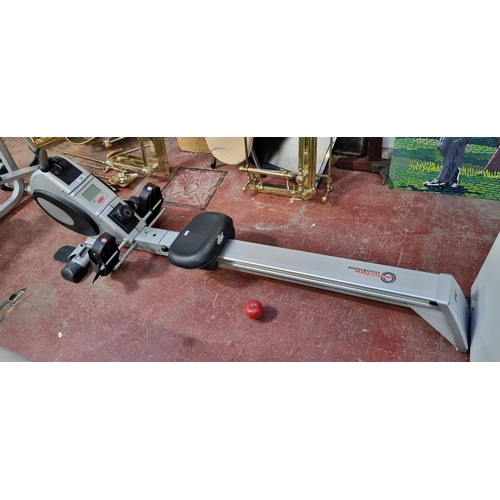 786 - A Crane Sports Waterflow rowing machine, with electronic display. Model no: 33933.