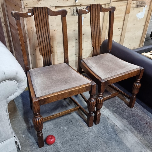 791 - A handsome pair of early 20th century matching chairs. Beautifully carved examples with a deeply ree... 