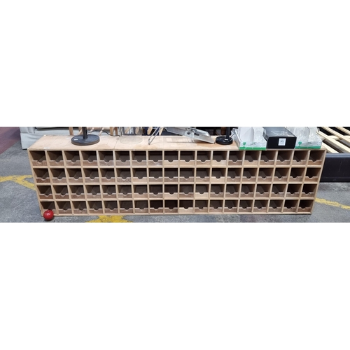 795 - A very large wooden wine rack unit with a generous storage capacity for 62 bottles. Crafted from lig... 