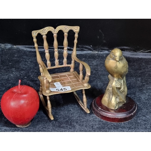 545 - Two handsome brass objects including a miniature rocking chair and a songbird perched on a stump.