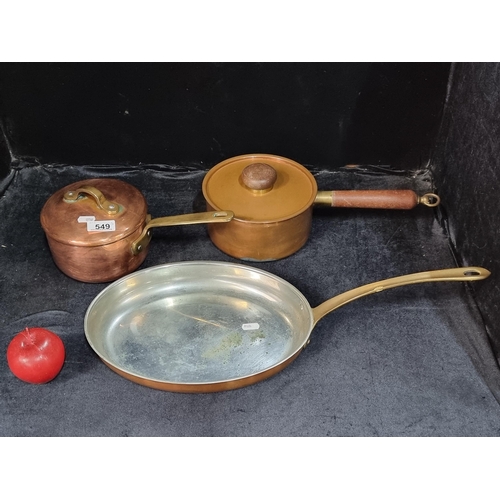 549 - Three good quality copper and brass kitchenware items comprising of two pots with lids and an unusua... 