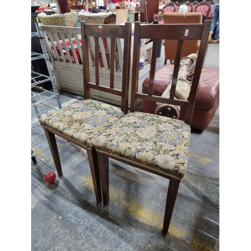 568 - A pair of Edwardian chairs with straight, geometric form and very lovely floral upholstered seat.