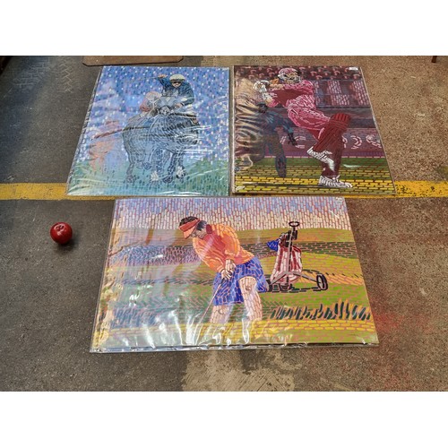 256 - A selection of three large acrylic of card paintings by the artist A.D Hurley. Each depicting sporti... 