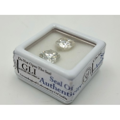 397 - A 4.74 carat pair of cushion cut white moissanite gem stones. With a 4.83 cushion cut white moissoni... 