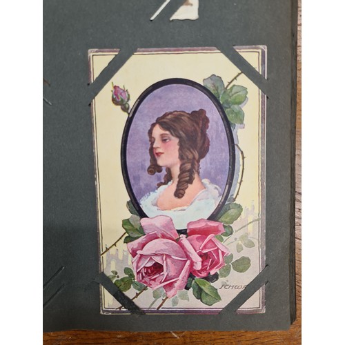 130 - An excellent Edwardian postcard album containing a selection of approximately sixty-five Edwardian p... 