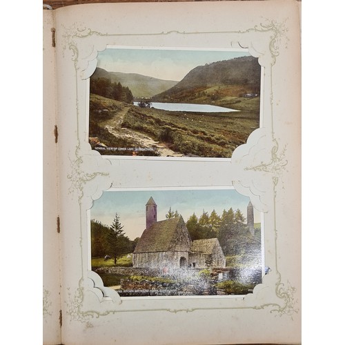 136 - An Art Nouveau postcard album. Filled with a selection of Irish and English late 19th century early ... 