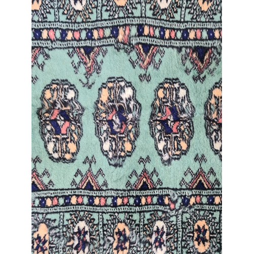 638 - Star lot : A genuine, hand knotted hall runner rug. Beautifully designed in shades of mint green wit... 