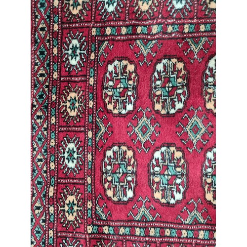 639 - Star Lot : A genuine handknotted hall runner rug. Beautifully designed in shades of rich red with ye... 