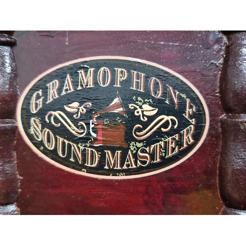 206 - A vintage Gramophone Soundmaster. Complete with a stunning brass horn and octagonal base.