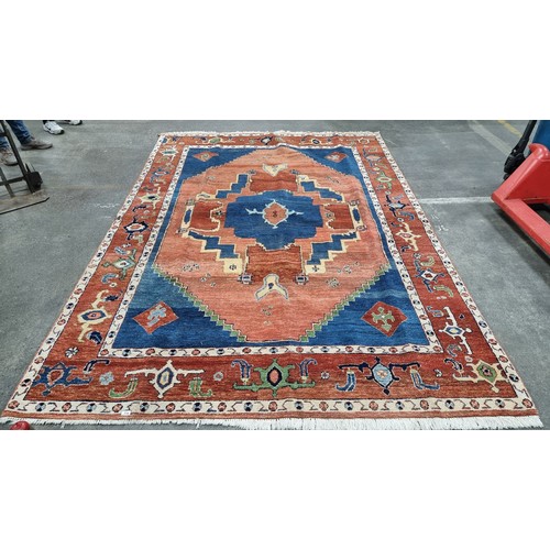 774 - Star lot : A large vintage  beautiful and heavy quality Persian wool rug in shades of orange and nav... 