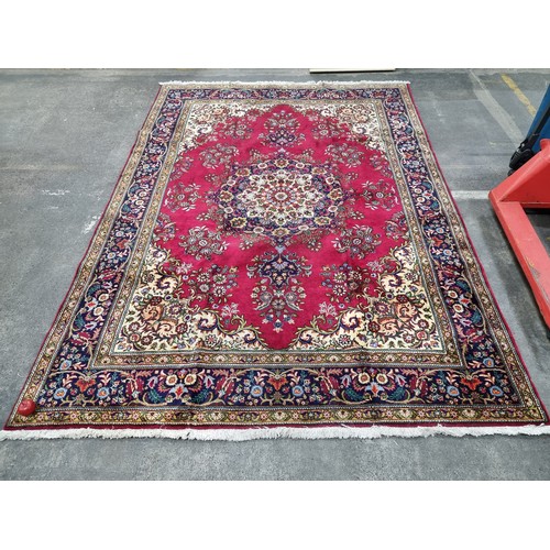 775 - Star lot : A fabulous large hand knotted wool Persian rug from the Tabriz province. In ruby shades o... 