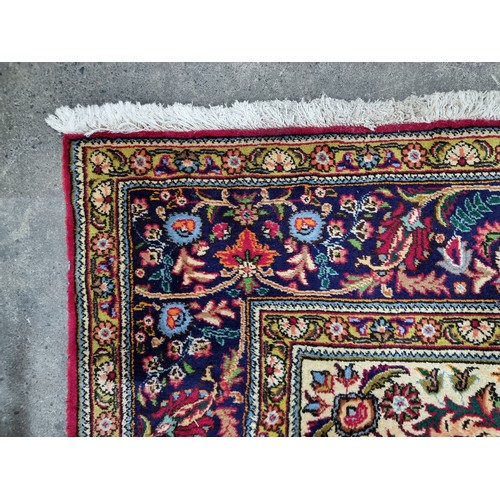 775 - Star lot : A fabulous large hand knotted wool Persian rug from the Tabriz province. In ruby shades o... 