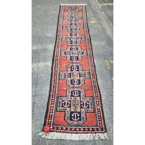 778 - Star lot : A hand knotted Persian wool warp cotton hall runner rug from the Meshkin province. In sha... 