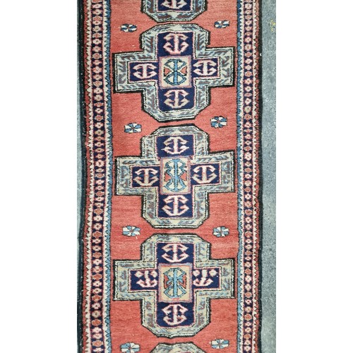 778 - Star lot : A hand knotted Persian wool warp cotton hall runner rug from the Meshkin province. In sha... 