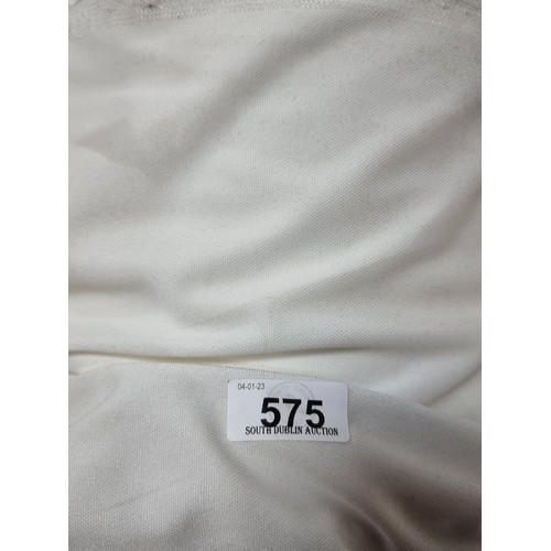 575 - A large bolt of cream, synthetic fabric with a satin side and no elastic give. Lots of value here.