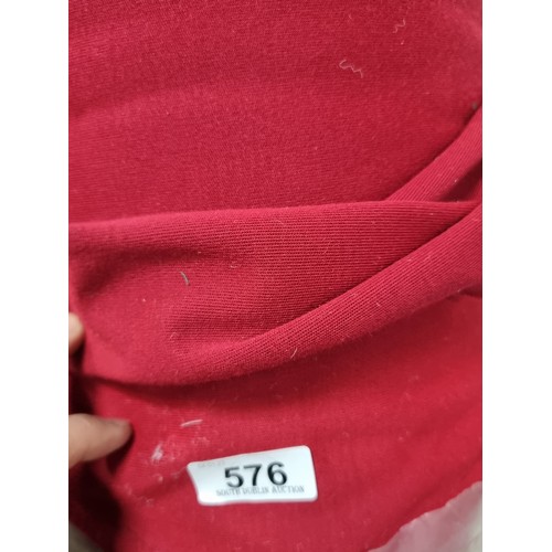 576 - A large bolt of ruby red fabric with slight elastic give. Lots of value here.