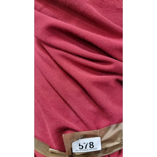 578 - A large bolt of burgundy, ribbed fabric with good elastic give. Lots of value here.