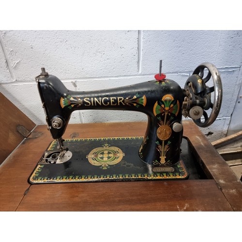 657 - Star Lot : A fabulous antique, Singer sewing machine circa 1923. Complete with an extending sewing m... 