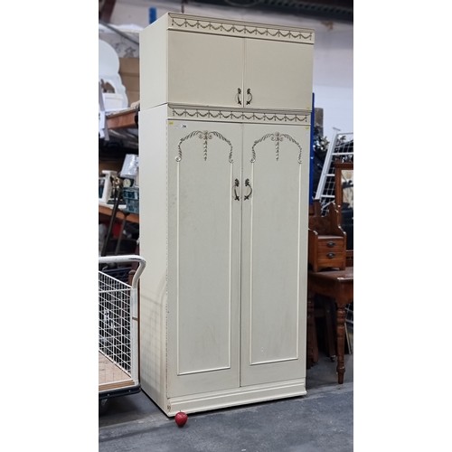 799 - An elegant French Louis style wardrobe by Jarman & Platt. With cupboard space to top and double door... 