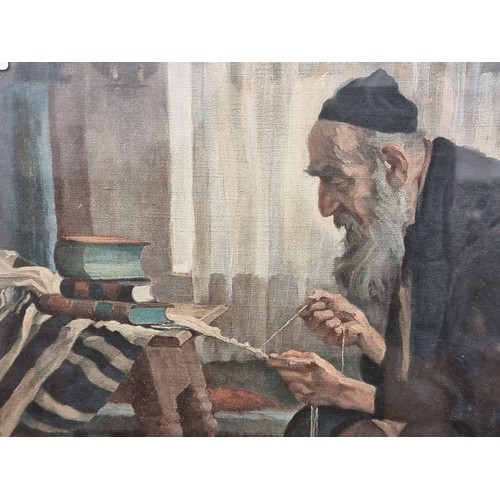 64 - An antique  print of a portrait of  a rabbi braiding the fringe of a tallit, housed in a glossy blac... 