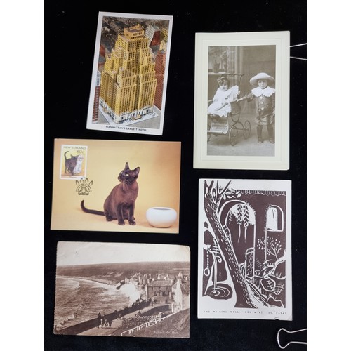 177 - An engrossing selection of over 100 vintage postcards, featuring many very interesting example. In a... 