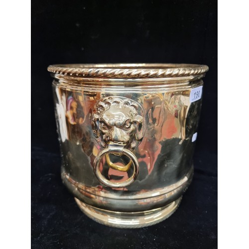 190 - A large antique polished brass coal scuttle. Depicting an unusual heraldic crest and lion mask drop ... 