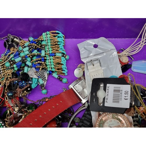 266 - A selection of costume jewellery including various beaded necklaces, earrings, watches and bangles, ... 