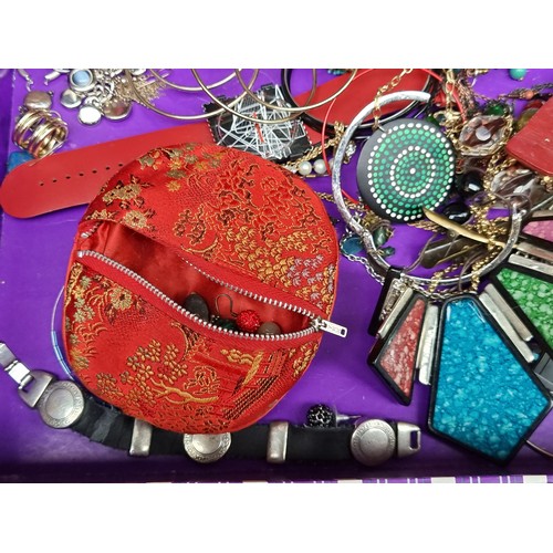 266 - A selection of costume jewellery including various beaded necklaces, earrings, watches and bangles, ... 