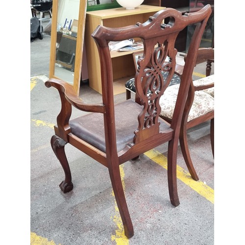 369 - A handsome antique Chippendale style library chair. Supported by large claw and ball feet, knotwork ... 