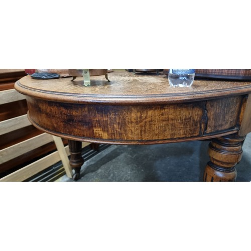 684 - Star Lot : A fabulous and unusual Victorian oak dining table of oval form. Carved from oak with heav... 