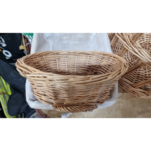 616 - A very large number of wicker baskets. Included are lobster style baskets, fruit baskets, flower bas... 