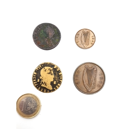 407 - A collection of 4 coins consisting of an Irish farthing penny, a Georgian token dated 1833, a 1940 I... 