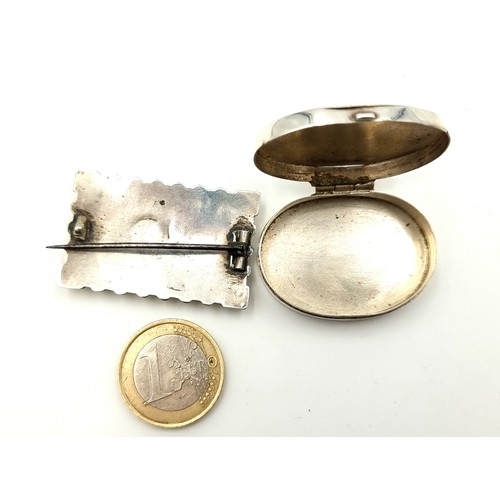 27 - Two sterling silver items consisting of a pillbox together with a brooch depicting a swallow flying ... 