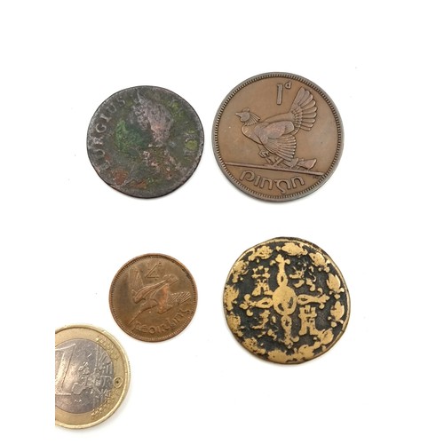 407 - A collection of 4 coins consisting of an Irish farthing penny, a Georgian token dated 1833, a 1940 I... 