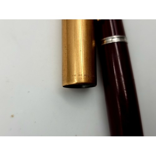 426 - Three Parker pens inc a vintage gold toned topped fountain pen and a ballpoint cross refill.