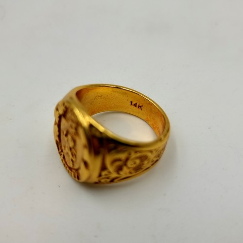 448 - A gold toned insignia Gents ring size U.
Weight: 13.23 grams With a lion and the word sweet. Its mar... 